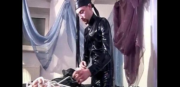  Man in latex dominates over this masked